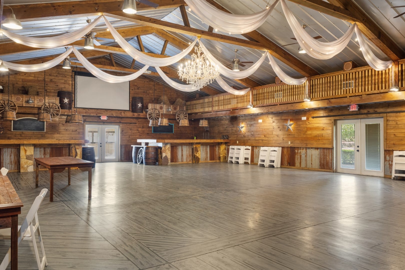 Barn wedding venue decorated for rustic wedding reception
