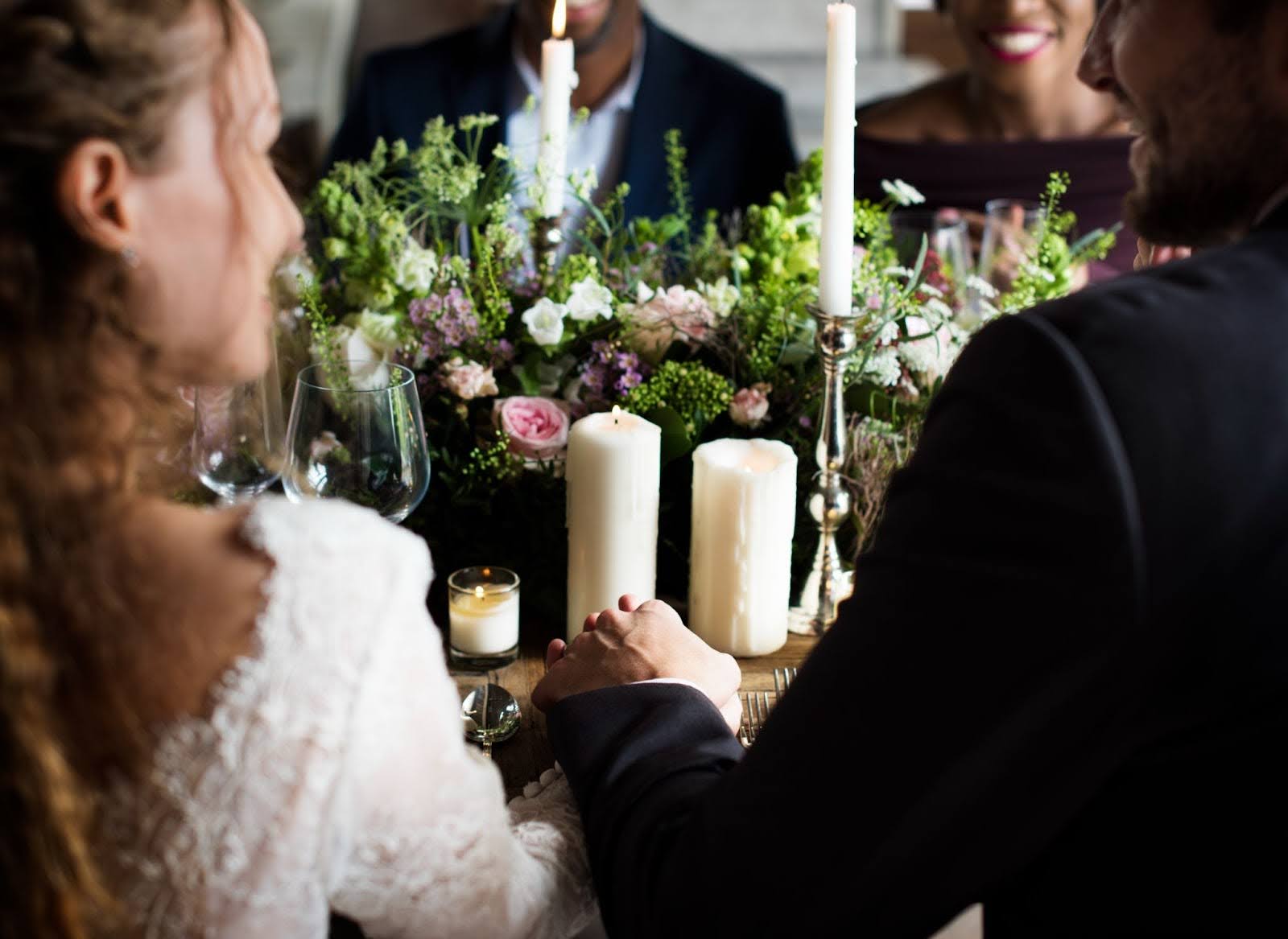 bride and groom infront of beautiful wedding display