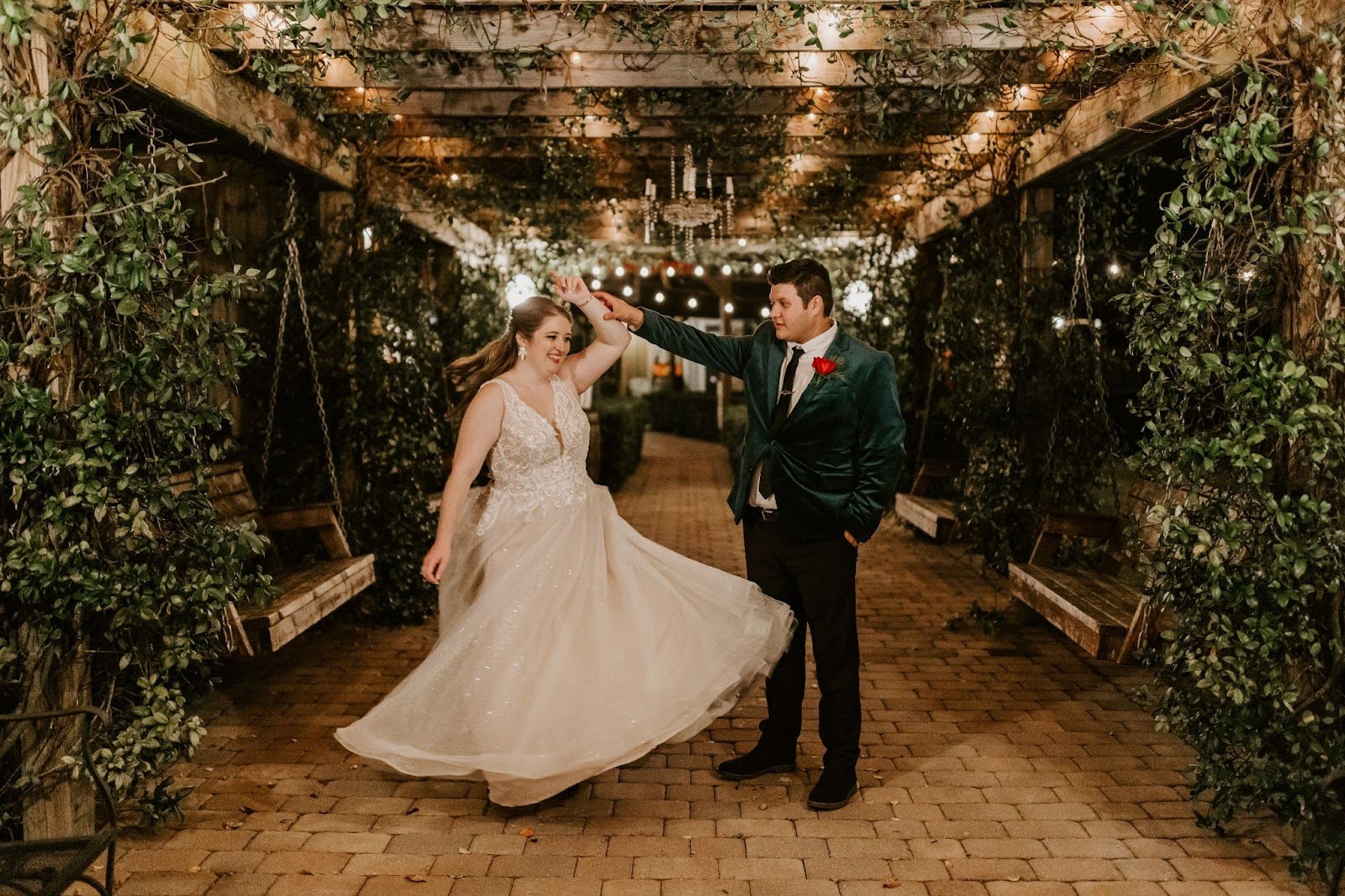 newlyweds dancing at hidden barn in garden