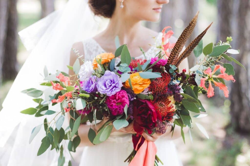 bride with rustic wedding flowers